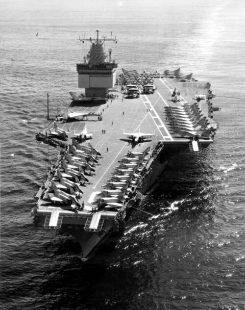USS Enterprise viewed from above while underway, with aircraft on its flight deck.